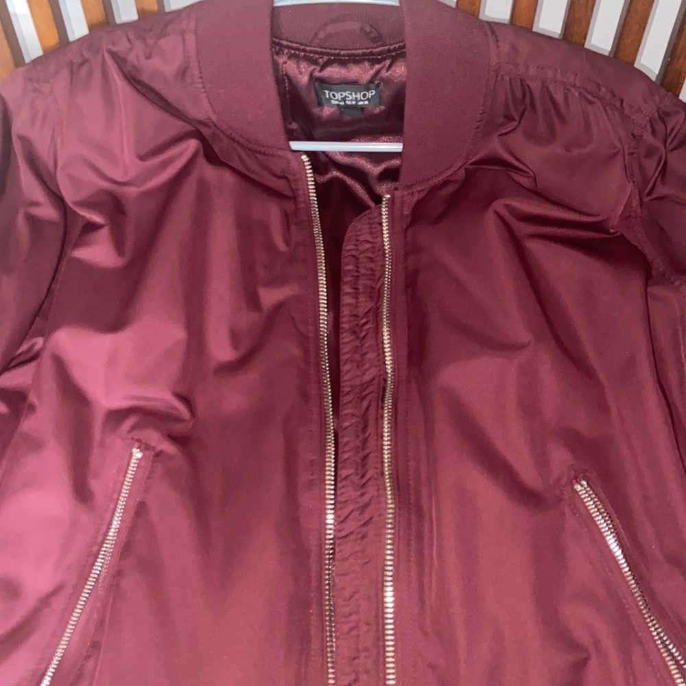 TopShop bomber in maroon.